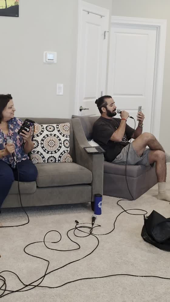 Two vocalists rehearsing on the couch
