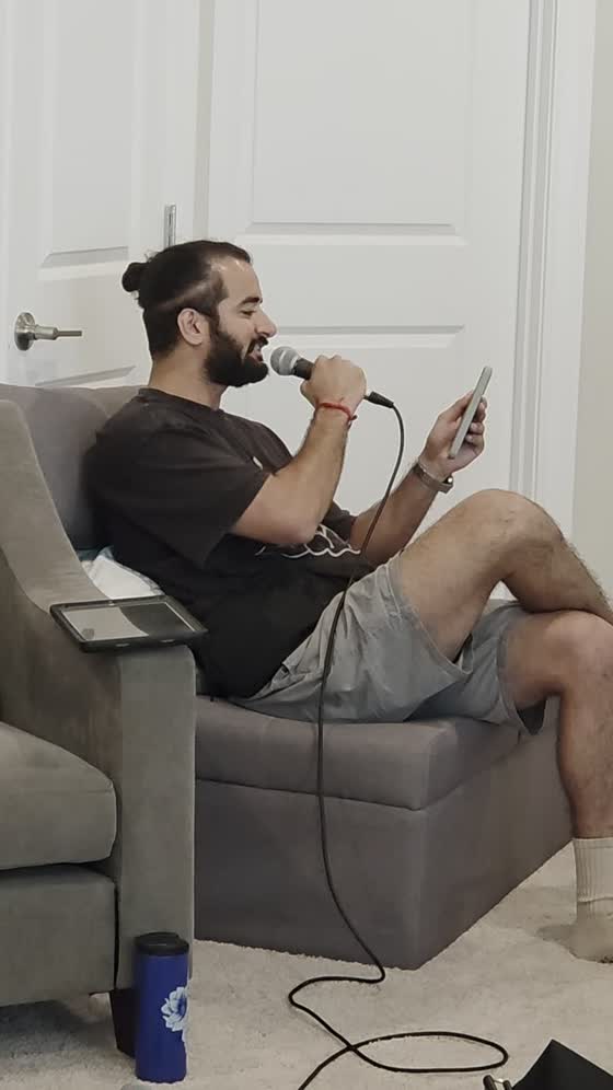 Vocalist singing into a microphone